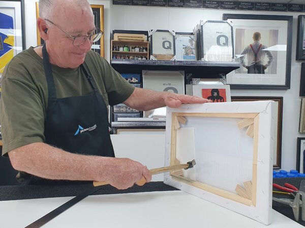 David adjusting canvvas tension